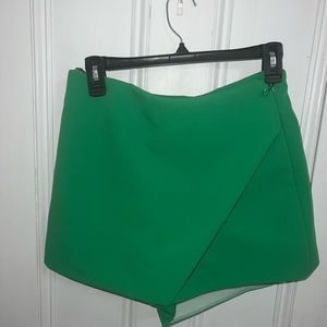 - Bright Green Skort (Shorts & Skirt). SIZE M ( Inside had shredded from washing